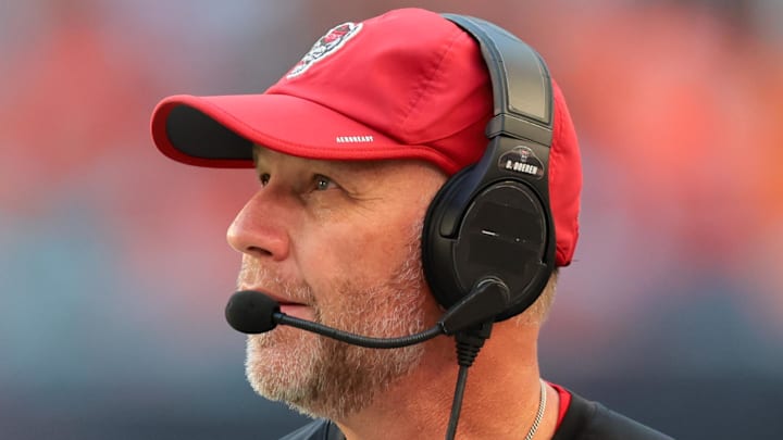 Nov 15, 2025; Miami Gardens, Florida, USA; NC State Wolfpack head coach Dave Doeren watches from the sideline against the Miami Hurricanes during the second quarter at Hard Rock Stadium. Mandatory Credit: Sam Navarro-Imagn Images