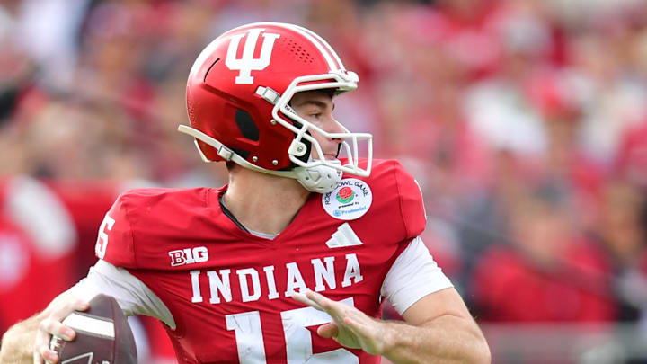 Jan 1, 2026; Pasadena, CA, USA; Indiana Hoosiers quarterback Fernando Mendoza (15) throws a pass for a touchdown against the Alabama Crimson Tide in the first half of the 2026 Rose Bowl and quarterfinal game of the College Football Playoff at Rose Bowl Stadium. Mandatory Credit: Gary A. Vasquez-Imagn Images