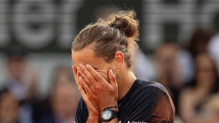 Alexander Zverev puts his hands over his face