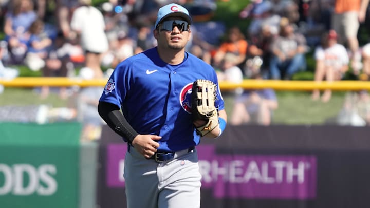Feb 22, 2026; Scottsdale, Arizona, USA; Chicago Cubs right fielder Seiya Suzuki (27) runs into the dugout against the San Francisco Giants in the third inning at Scottsdale Stadium. Mandatory Credit: Rick Scuteri-Imagn Images