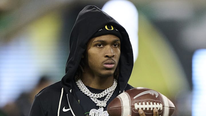 Nov 14, 2025; Eugene, Oregon, USA; Oregon Ducks wide receiver Dakorien Moore (1) watches teammates warm up before a game against the Minnesota Golden Gophers at Autzen Stadium. Mandatory Credit: Troy Wayrynen-Imagn Images