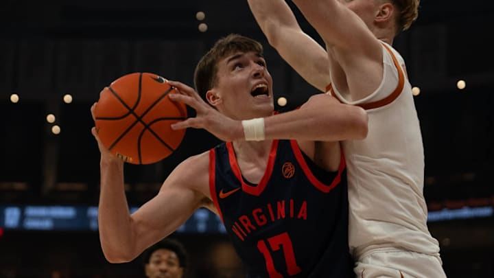 Virginia's Johan Grunloh posts up Texas'  Matas Vokietaitis