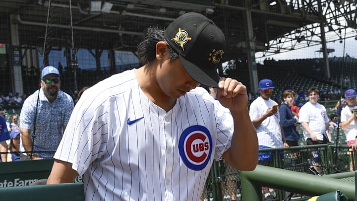 May 18, 2024; Chicago, Illinois, USA; Chicago Cubs pitcher Shota Imanaga (18) enters the field