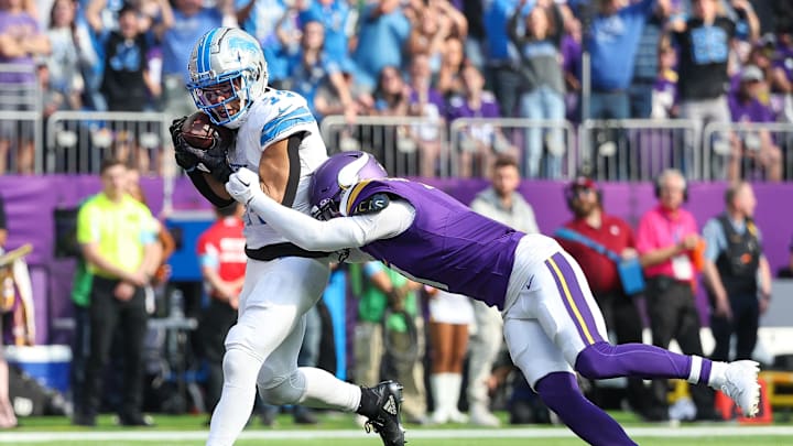 Amon-Ra St. Brown catches a pass for a touchdown against the Vikings in October.