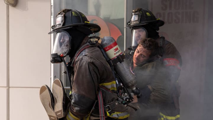 CHICAGO FIRE -- "Exit Point" Episode 1419 -- Pictured: (l-r) Jamal Akakpo as Holt, Joe Minoso as Cruz 