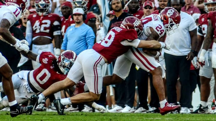 Oklahoma running back Xavier Robinson rushes against Alabama. Oklahoma running back Xavier Robinson rushes against Alabama.