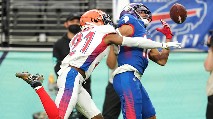 AFC cornerback Denzel Ward of the Cleveland Browns (21) breaks up a pass intended for NFC wide receiver Justin Jefferson of the Minnesota Vikings (18) during the Pro Bowl football game at Allegiant Stadium.