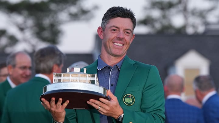 Rory McIlroy holds the Masters championship trophy.