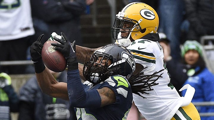 Seattle Seahawks cornerback Richard Sherman (25) intercepts  a pass intended for Green Bay Packers receiver Davante Adams.