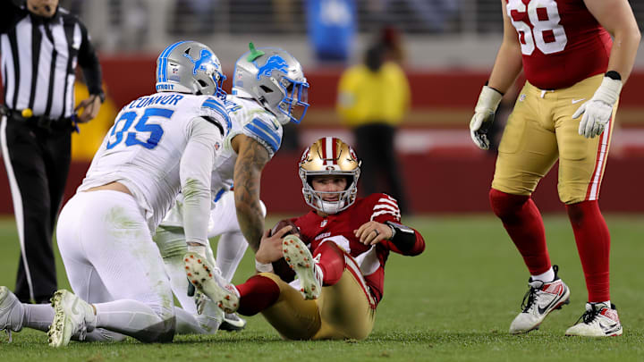 San Francisco 49ers quarterback Brock Purdy is sacked by Detroit Lions safety Brian Branch during the fourth quarter at Levi's Stadium. San Francisco 49ers quarterback Brock Purdy is sacked by Detroit Lions safety Brian Branch during the fourth quarter at Levi's Stadium.