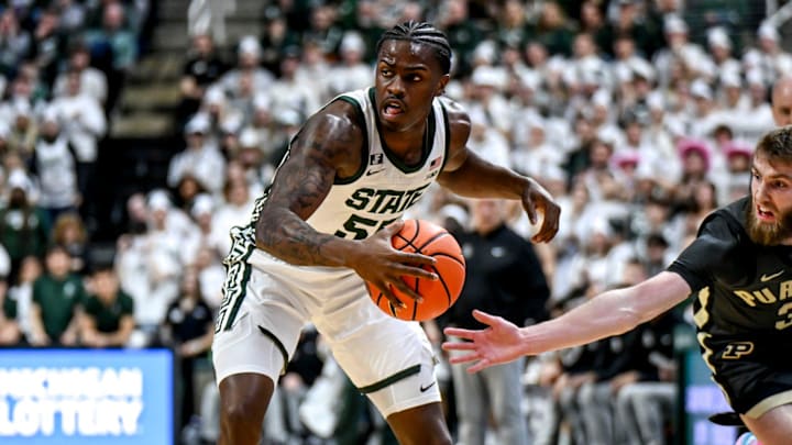 Michigan State's Coen Carr, left, moves the ball as Purdue's Braden Smith closes in during the first half on Tuesday, Feb. 18, 2025, at the Breslin Center in East Lansing. Michigan State's Coen Carr, left, moves the ball as Purdue's Braden Smith closes in during the first half on Tuesday, Feb. 18, 2025, at the Breslin Center in East Lansing.