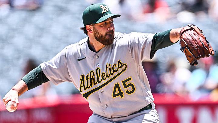 Athletics starting pitcher Aaron Civale (45) throws a pitch Athletics starting pitcher Aaron Civale (45) throws a pitch