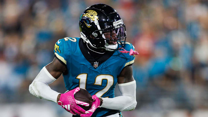 Oct 6, 2025; Jacksonville, Florida, USA; Jacksonville Jaguars wide receiver Travis Hunter (12) runs the ball against the Kansas City Chiefs during the second half at EverBank Stadium. Mandatory Credit: Morgan Tencza-Imagn Images