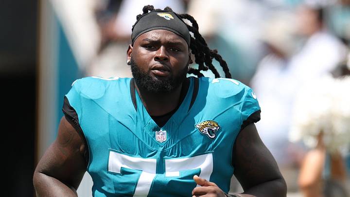 Sep 7, 2025; Jacksonville, Florida, USA; Jacksonville Jaguars offensive tackle Anton Harrison (77) takes the field prior to a game against the Carolina Panthers at EverBank Stadium. Mandatory Credit: Nathan Ray Seebeck-Imagn Images