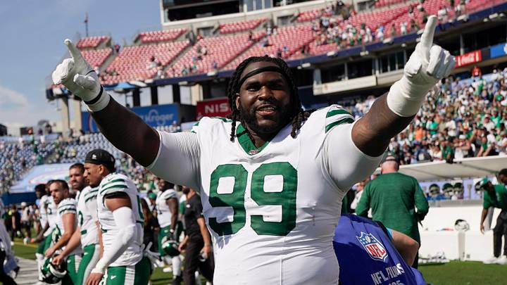 New York Jets defensive tackle T'vondre Sweat (99) celebrates after the game against the Tennessee Titans at Nissan Stadium in Nashville, Tenn., Sunday, Sept. 13, 2026.