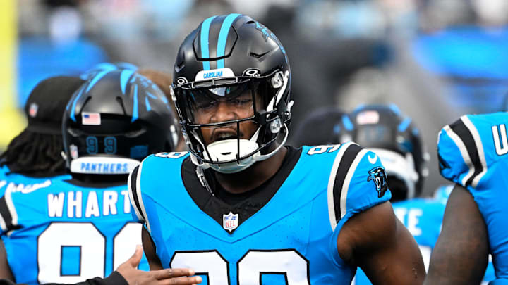 Former Carolina Panthers linebacker D.J. Wonnum (98) runs on to the field before the game at Bank of America Stadium