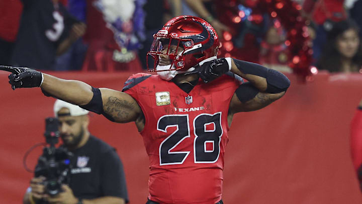 Nov 10, 2024; Houston, Texas, USA; Houston Texans running back Joe Mixon (28) signals after rushing for a first down during the first quarter against the Detroit Lions at NRG Stadium. Mandatory Credit: Troy Taormina-Imagn Images