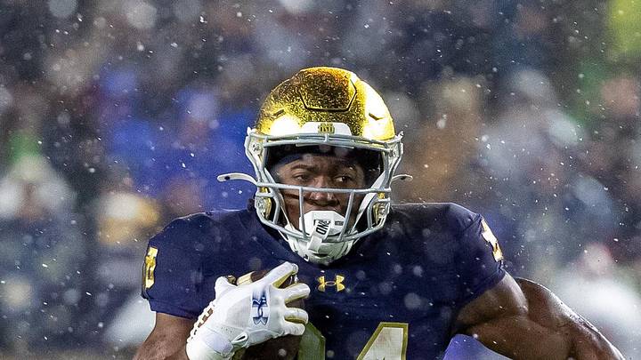 Notre Dame Fighting Irish running back Jadarian Price runs the ball against the Navy Midshipmen.