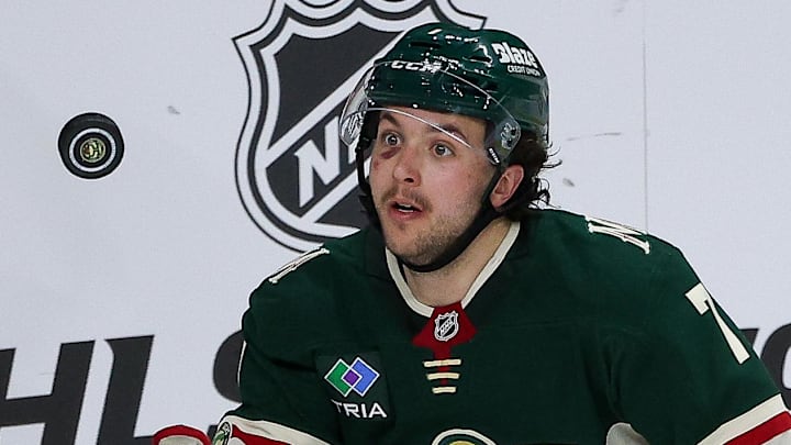 Apr 22, 2026; Saint Paul, Minnesota, USA; Minnesota Wild defenseman Brock Faber (7) reaches for the puck as Dallas Stars defenseman Esa Lindell (23) defends during the second period in game three of the first round of the 2026 Stanley Cup Playoffs at Grand Casino Arena. Mandatory Credit: Matt Krohn-Imagn Images