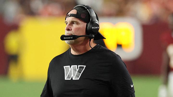 Aug 14, 2026; Landover, Maryland, USA; Washington Commanders head coach Dan Quinn looks on from the sidelines against the Miami Dolphins during the first half at Northwest Stadium. Mandatory Credit: Geoff Burke-Imagn Images