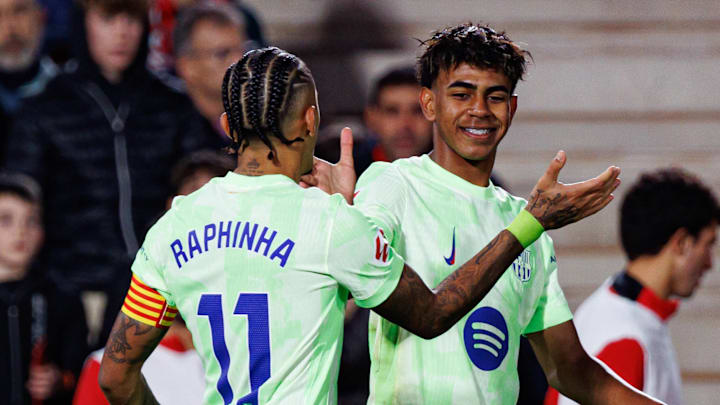 Raphinha (left) and Lamine Yamal (right) celebrate a goal against Mallorca.