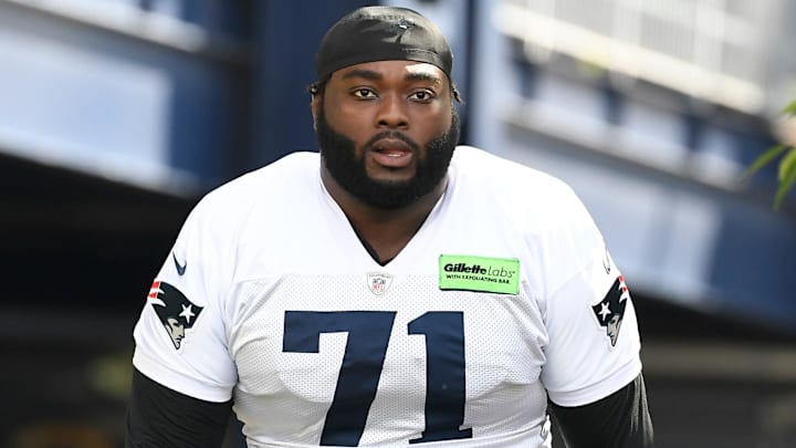 Jul 30, 2022; Foxborough, MA, USA; New England Patriots guard Mike Onwenu (71) walks to the practice field at the Patriots training camp at Gillette Stadium. Mandatory Credit: Eric Canha-Imagn Images