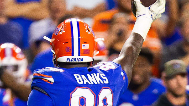 Florida Gators defensive lineman Caleb Banks (88) comes up the fumble during the second half at Ben Hill Griffin Stadium in Gainesville, FL on Saturday, November 16, 2024. The Gators defeated the Tigers 27-16. [Doug Engle/Gainesville Sun]