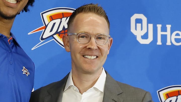 Jun 25, 2022; Oklahoma City, OK, USA; Oklahoma City Thunder forward Jaylin Williams poses with his jersey and general manager Sam Presti following an introductory press conference at Clara Luper Center. Mandatory Credit: Alonzo Adams-Imagn Images