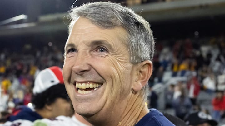 Nov 28, 2025; Tempe, Arizona, USA; Arizona Wildcats head coach Brent Brennan celebrates against the Arizona State Sun Devils during the 99th Territorial Cup at Mountain America Stadium. Mandatory Credit: Mark J. Rebilas-Imagn Images