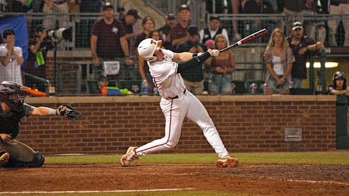 Texas Longhorns catcher Kimble Schuessler hits against the Texas A&M Aggies during the second round in the NCAA baseball College Station Regional