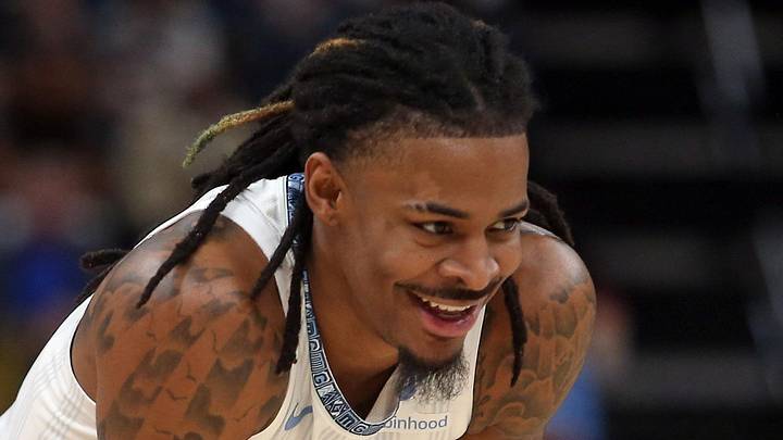 Dec 26, 2025; Memphis, Tennessee, USA; Memphis Grizzlies guard Ja Morant (12) reacts during the second quarter against the Milwaukee Bucks at FedExForum. Mandatory Credit: Petre Thomas-Imagn Images