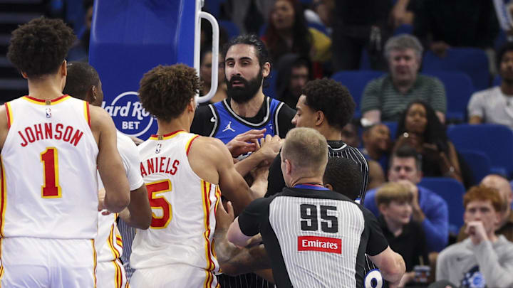Apr 1, 2026; Orlando, Florida, USA; Atlanta Hawks forward Jalen Johnson (1) and guard Dyson Daniels (5) react to a foul by Orlando Magic center Goga Bitadze (35) in the fourth quarter at Kia Center. Mandatory Credit: Nathan Ray Seebeck-Imagn Images