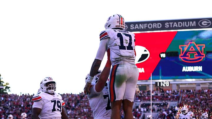 Oct 17, 2026; Athens, Georgia, USA;  Auburn quarterback Byrum Brown (17) celebrates with teammates following a touchdown during the fourth quarter against Georgia at Sanford Stadium.  Mandatory Credit: Dale Zanine-Imagn Images