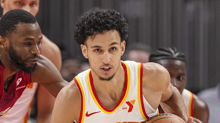 Feb 24, 2025; Atlanta, Georgia, USA; Atlanta Hawks forward Zaccharie Risacher (10) steals the ball from Miami Heat forward Andrew Wiggins (22) during the second half at State Farm Arena. Mandatory Credit: Dale Zanine-Imagn Images