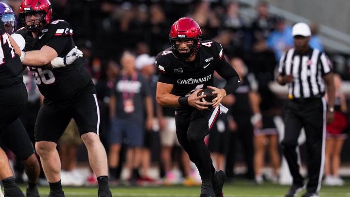Sep 12, 2026; Cincinnati, Ohio, USA; Cincinnati Bearcats quarterback JC French IV (4) runs with the ball against the Western Carolina Catamounts in the first half at Nippert Stadium. Mandatory Credit: Aaron Doster-Imagn Images Sep 12, 2026; Cincinnati, Ohio, USA; Cincinnati Bearcats quarterback JC French IV (4) runs with the ball against the Western Carolina Catamounts in the first half at Nippert Stadium. Mandatory Credit: Aaron Doster-Imagn Images