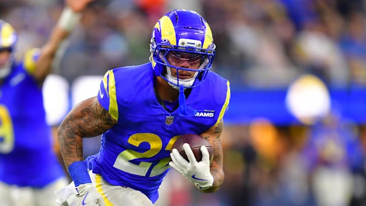 Dec 14, 2025; Inglewood, California, USA; Los Angeles Rams running back Blake Corum (22) runs the ball during the third quarter against the Detroit Lions at SoFi Stadium. Mandatory Credit: Gary A. Vasquez-Imagn Images Dec 14, 2025; Inglewood, California, USA; Los Angeles Rams running back Blake Corum (22) runs the ball during the third quarter against the Detroit Lions at SoFi Stadium. Mandatory Credit: Gary A. Vasquez-Imagn Images