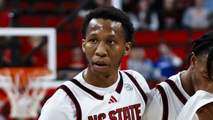 Dec 6, 2025; Raleigh, North Carolina, USA; NC State Wolfpack guard Quadir Copeland (11) consoles guard Jr. Paul McNeil (2) during the second half of the game against UNC Asheville Bulldogs at Lenovo Center. Mandatory Credit: Jaylynn Nash-Imagn Images Dec 6, 2025; Raleigh, North Carolina, USA; NC State Wolfpack guard Quadir Copeland (11) consoles guard Jr. Paul McNeil (2) during the second half of the game against UNC Asheville Bulldogs at Lenovo Center. Mandatory Credit: Jaylynn Nash-Imagn Images