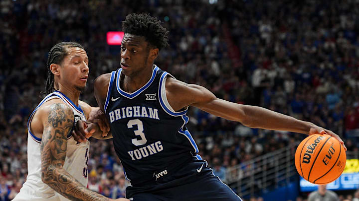 Jan 24, 2026; Columbia, Missouri, USA; BYU Cougars forward AJ Dybantsa (3) drives against Kansas Jayhawks guard Tre White (3) during the first half at Mizzou Arena. Mandatory Credit: Jay Biggerstaff-Imagn Images