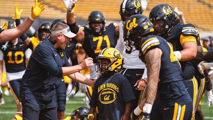 Cal coach Tosh Lupoi encourages Xander Jones