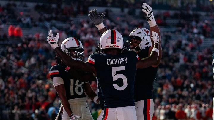 Virginia Cavaliers wide receivers celebrate a touchdown against the Syracuse Orange. Virginia Cavaliers wide receivers celebrate a touchdown against the Syracuse Orange.