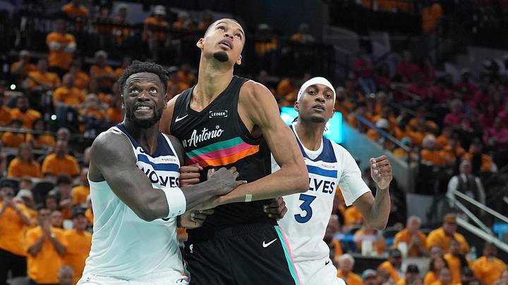 May 4, 2026; San Antonio, Texas, USA; Minnesota Timberwolves forwards Julius Randle (30) and Jaden McDaniels (3) try to keep San Antonio Spurs forward Victor Wembanyama (1) back in the second half during Game 1 of the second round of the 2026 NBA Playoffs at Frost Bank Center.