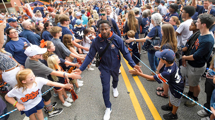Cadillac Williams takes part in the Tiger Walk before the AU vs. Samford game at Jordan-Hare Stadium