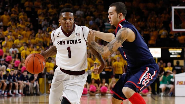 Feb 14, 2014; Tempe, AZ, USA; Arizona State Sun Devils guard Jahii Carson (1) drives on Arizona Wildcats guard Gabe York (1) during the second half at Wells Fargo Arena. The Sun Devils defeated the Wildcats 69-66 in double overtime. Mandatory Credit: Rick Scuteri-Imagn Images