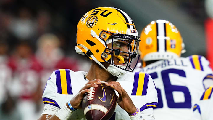 Nov 4, 2023; Tuscaloosa, Alabama, USA; LSU Tigers quarterback Jayden Daniels (5) drops back to pass against the Alabama Crimson Tide during the second quarter at Bryant-Denny Stadium. Mandatory Credit: John David Mercer-USA TODAY Sports