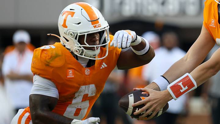 Sep 5, 2026; Knoxville, Tennessee, USA; Tennessee Volunteers quarterback George MacIntyre (12) hands the ball off to running back Javin Gordon (6) during the second half against the Furman Paladins at Neyland Stadium. Mandatory Credit: Randy Sartin-Imagn Images Sep 5, 2026; Knoxville, Tennessee, USA; Tennessee Volunteers quarterback George MacIntyre (12) hands the ball off to running back Javin Gordon (6) during the second half against the Furman Paladins at Neyland Stadium. Mandatory Credit: Randy Sartin-Imagn Images