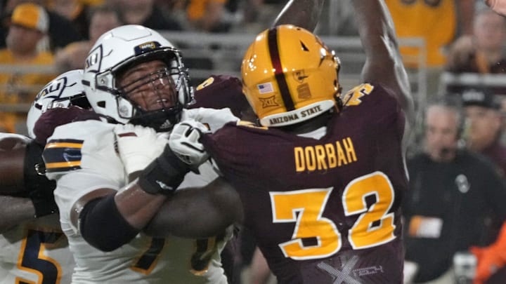 Arizona State Sun Devils defensive lineman Prince Dorbah (32) attempts to block the pass by Northern Arizona Lumberjacks quarterback Ty Pennington (6) during a football game at Mountain America Stadium in Tempe on Aug. 30, 2025.