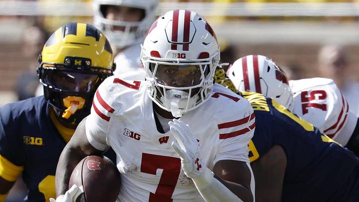 Wisconsin Badgers running back Dilin Jones (7) rushes in the first half against the Michigan Wolverines at Michigan Stadium. 