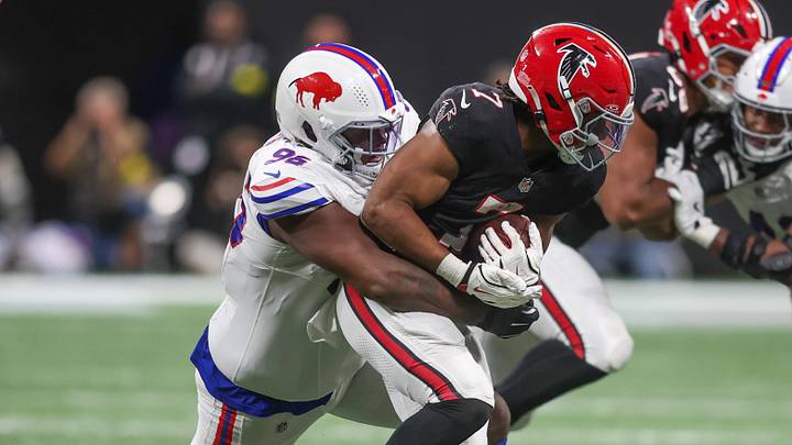 Oct 13, 2025; Atlanta, Georgia, USA; Atlanta Falcons running back Bijan Robinson (7) is tackled by Buffalo Bills defensive tackle Deone Walker (96) during the second half of a game at Mercedes-Benz Stadium.