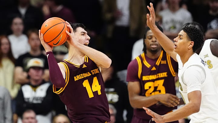 Feb 7, 2026; Boulder, Colorado, USA; Colorado Buffaloes guard Jalin Holland (11) defends on Arizona State Sun Devils forward Andrija Grbovic (14) in the second half at the CU Events Center. Mandatory Credit: Ron Chenoy-Imagn Images