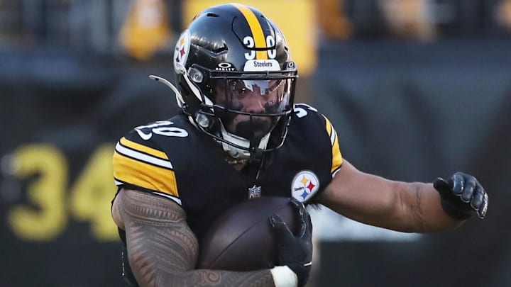 Dec 8, 2024; Pittsburgh, Pennsylvania, USA;  Pittsburgh Steelers running back Jaylen Warren (30) rushes the ball against the Cleveland Browns during the second quarter at Acrisure Stadium. Mandatory Credit: Charles LeClaire-Imagn Images